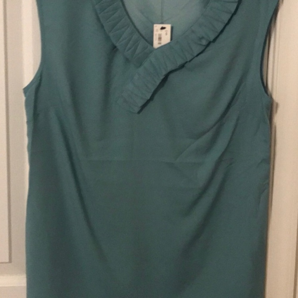 Mint green sleeveless blouse